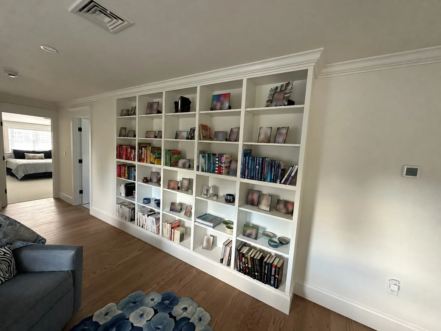 White wall-to-wall bookcase in a living space