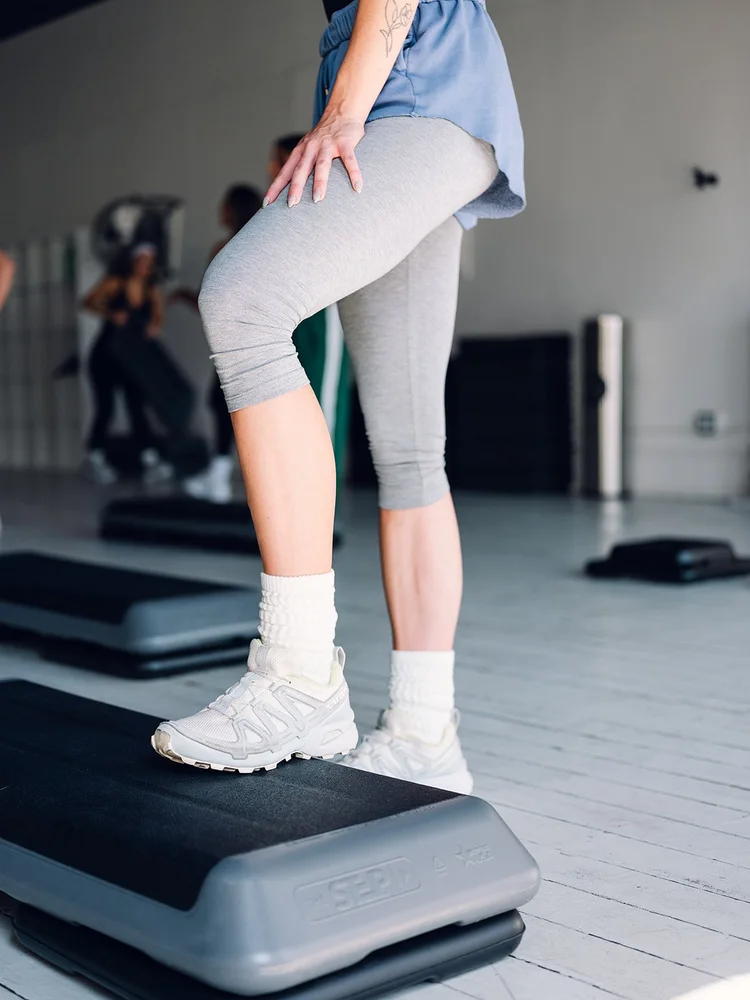 A member stepping up onto a step platform