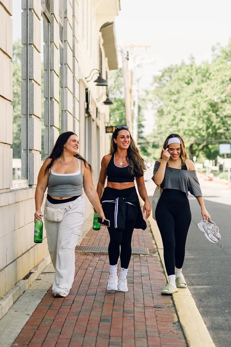 Members walking down Main Street together after class