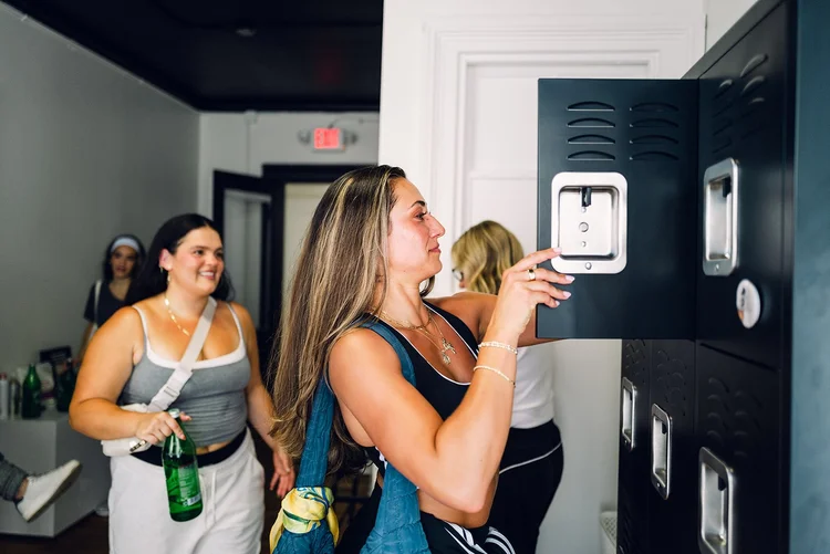 Members chatting at the lockers before class