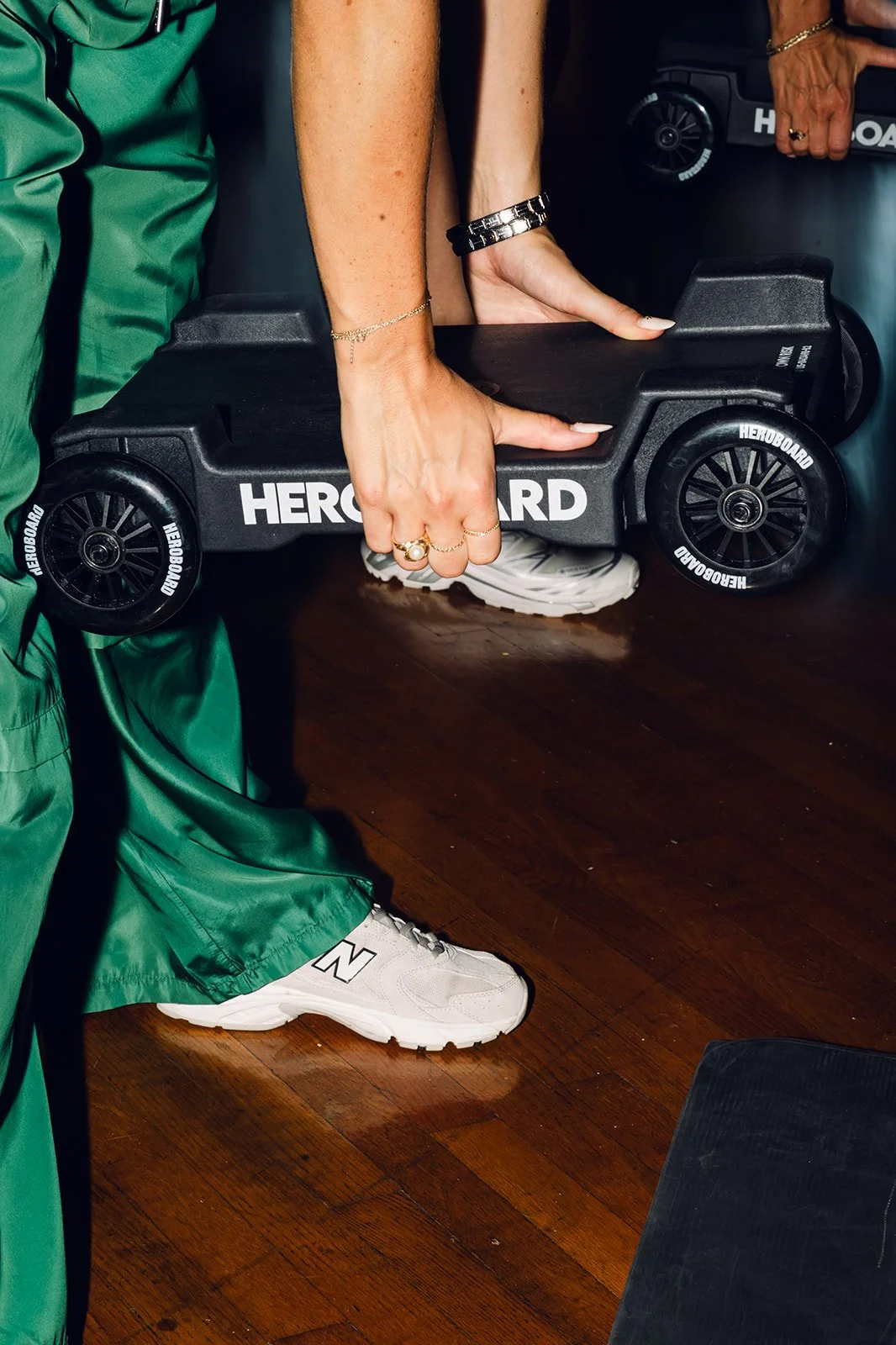A member picking up her HEROBOARD before Slide