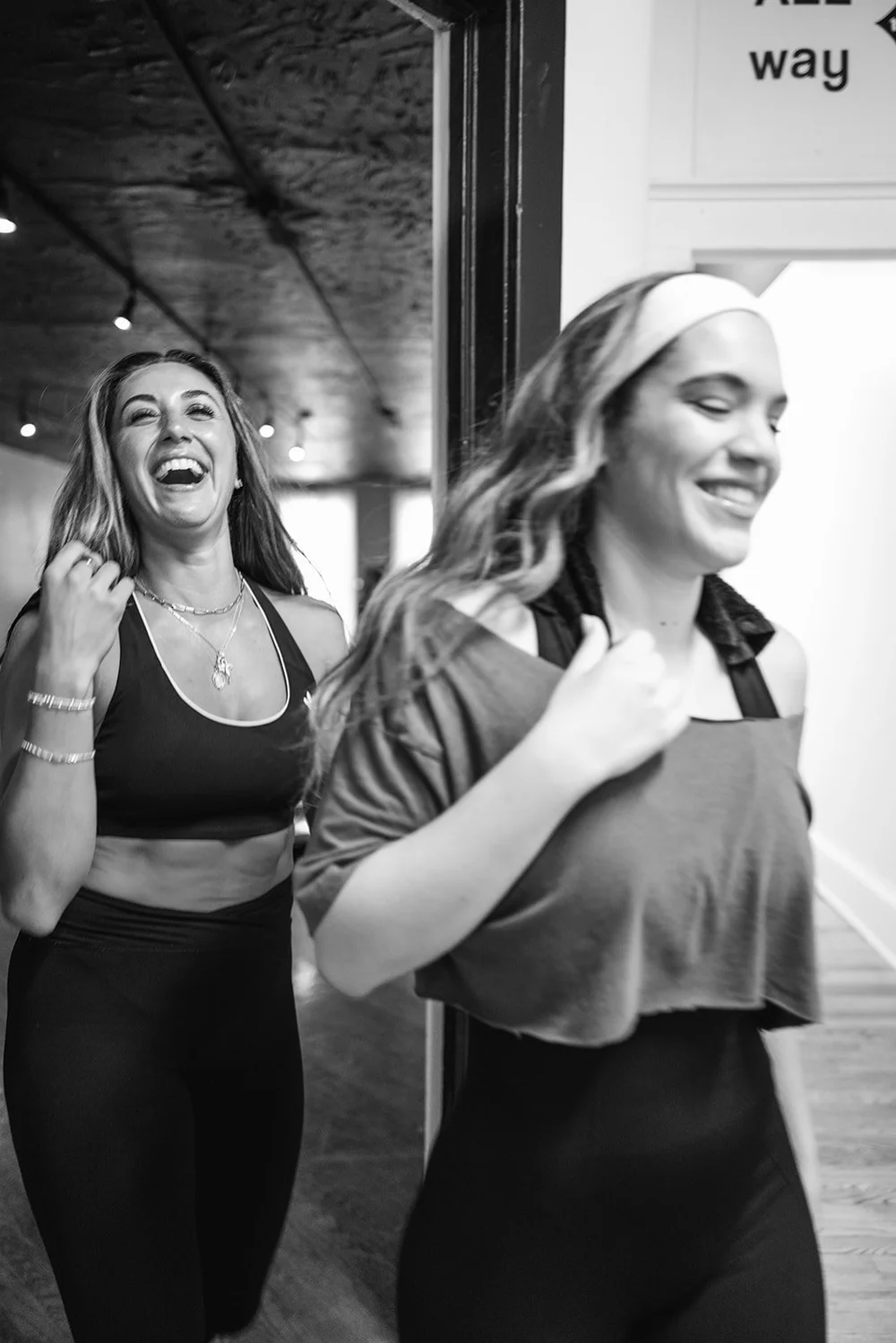 Two MARGO'S members laughing together in the studio