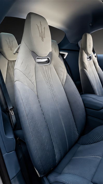 Light-coloured automotive seats with sculptural textured surfaces