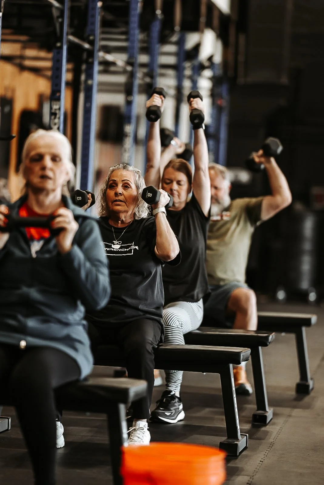 Legends 60+ class pressing dumbbells