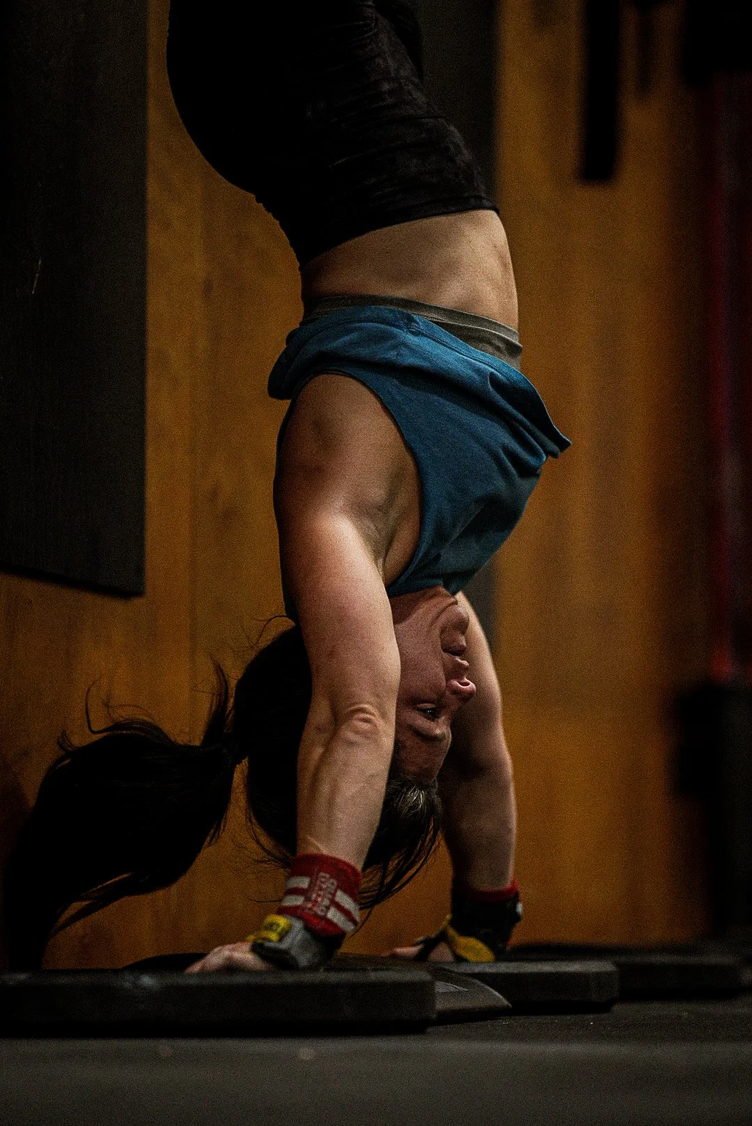 Handstand push-up against the oak wall