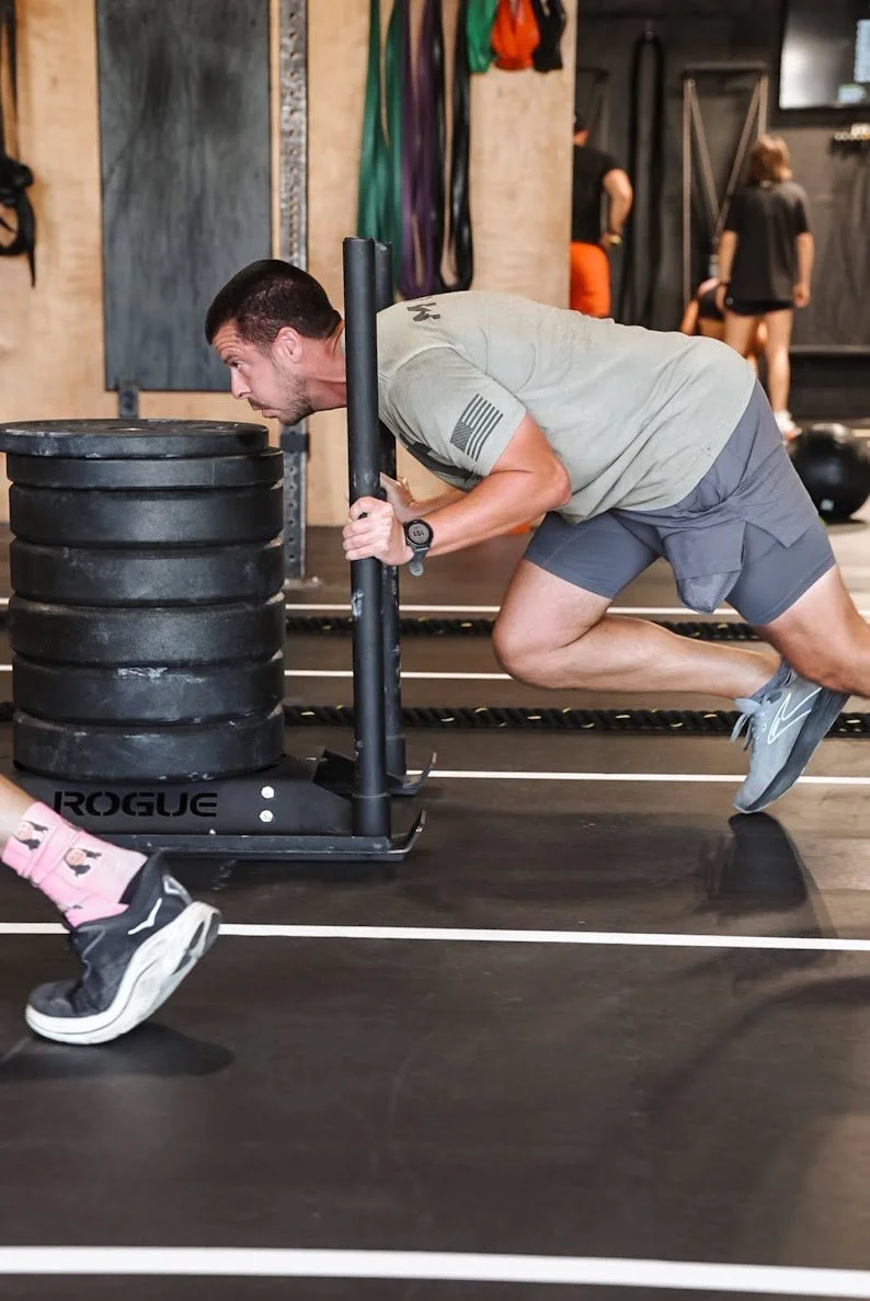 Athlete working under a coach's eye at CrossFit Trussville