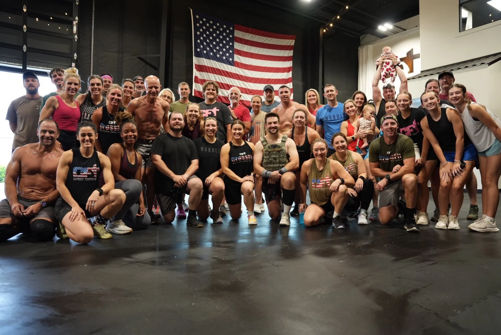 CFT members gathered under the flag after a hero workout