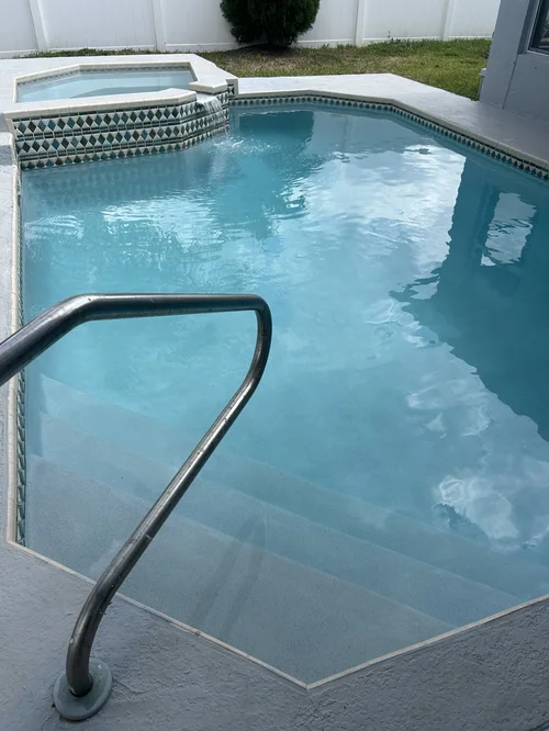 Refilled swimming pool and raised spa following resurfacing in The Heights, Jupiter.