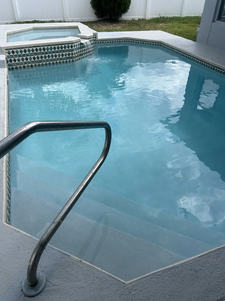 Refilled swimming pool and raised spa following resurfacing in The Heights, Jupiter.