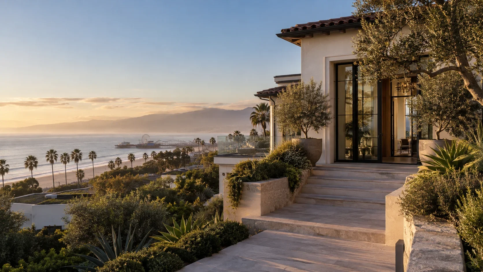 Santa Monica coastal residence overlooking the shoreline and pier in warm light