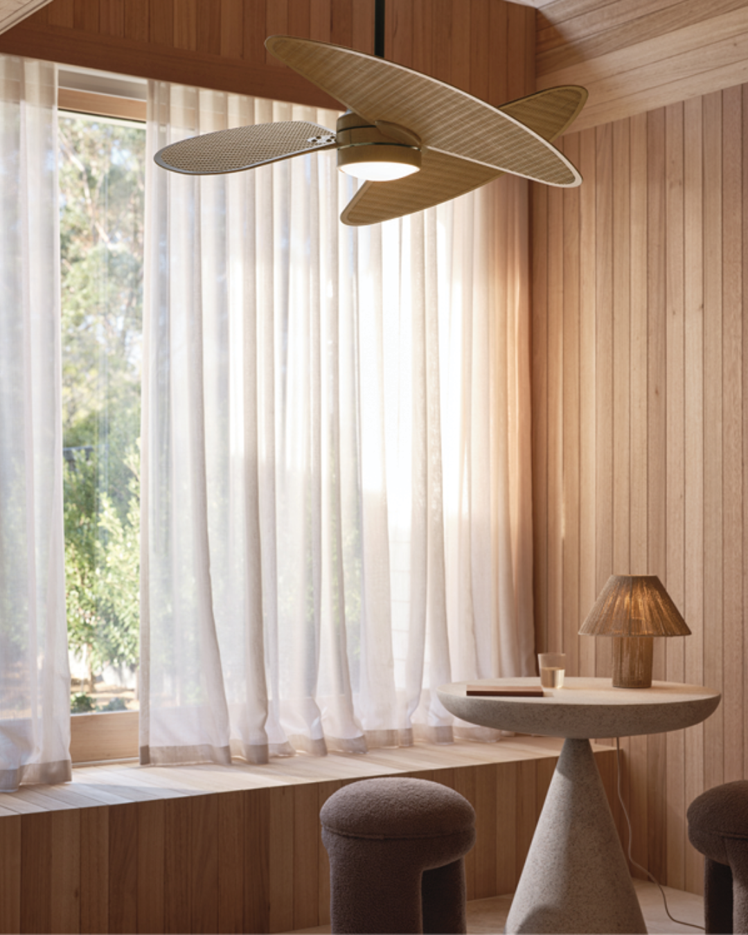 Stylish timber ceiling fan installed in a bright interior