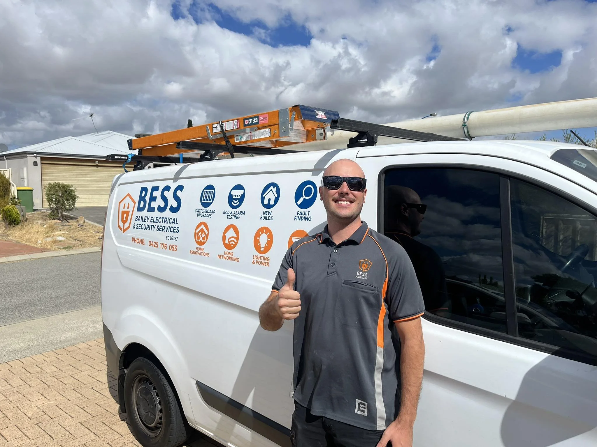 BESS electrician with Bailey Electrical and Security Services vehicle in Perth
