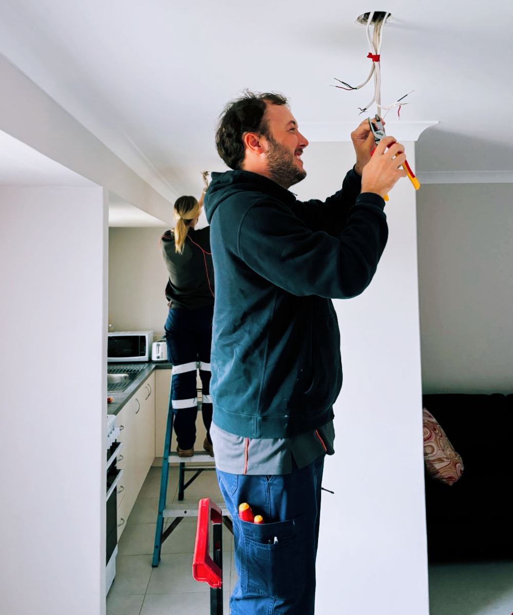 BESS electrician completing residential electrical work in a Perth home