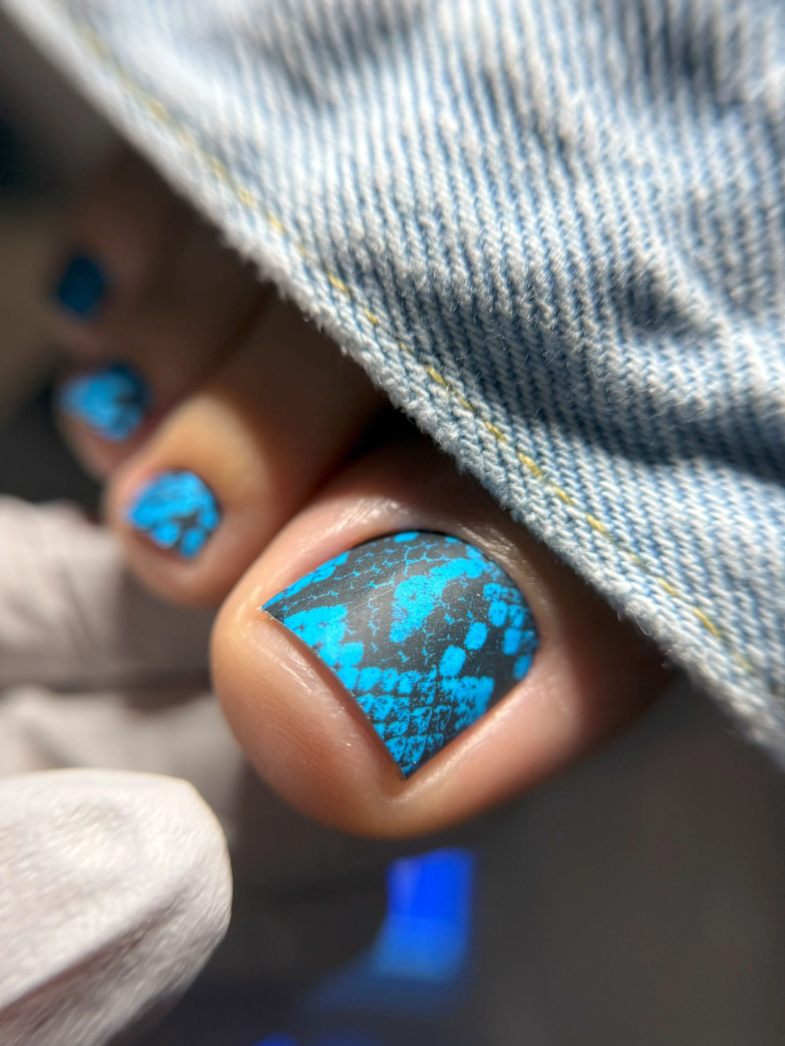Close-up of a Russian dry pedicure with toe wraps