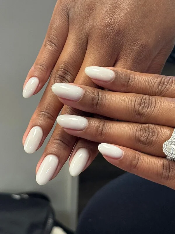 Milky white builder gel manicure on almond-shaped natural nails at Nail House USA in Jacksonville