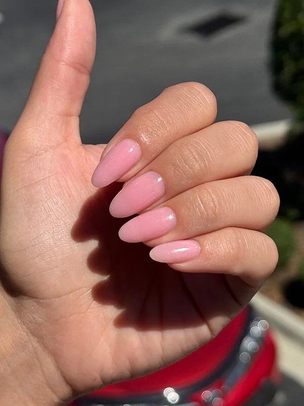 Soft pink builder gel manicure on almond-shaped natural nails at Nail House USA in Jacksonville