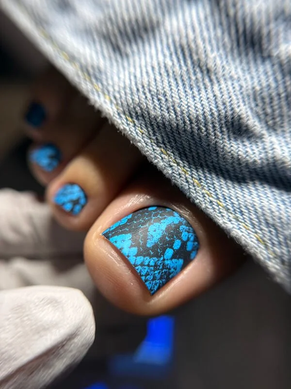 Russian dry pedicure with blue nail design at Nail House USA in Jacksonville