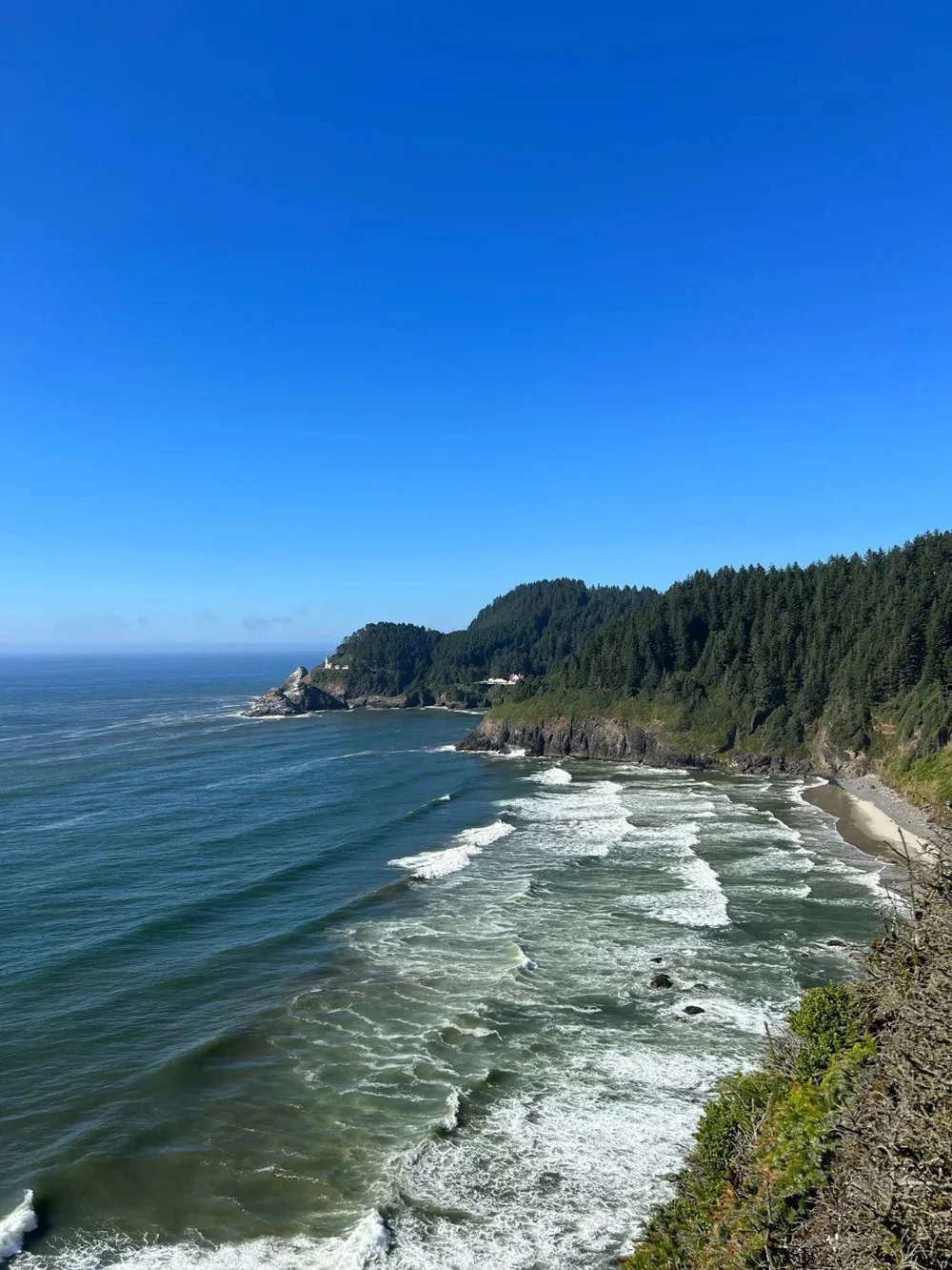 Heceta Head Lighthouse above the surf on the Oregon Coast