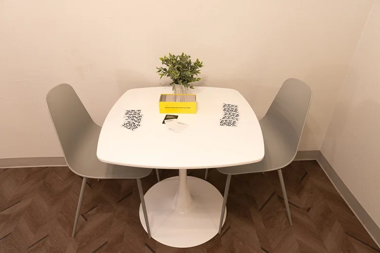 Round dining table with chairs in room 105