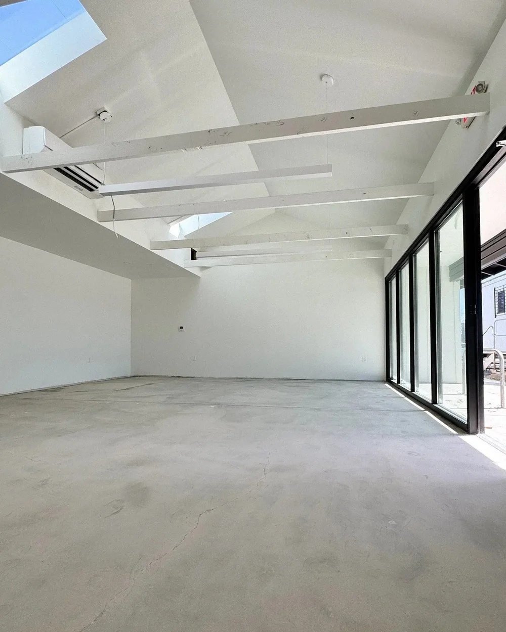 Suite 120 with skylights over a long open room