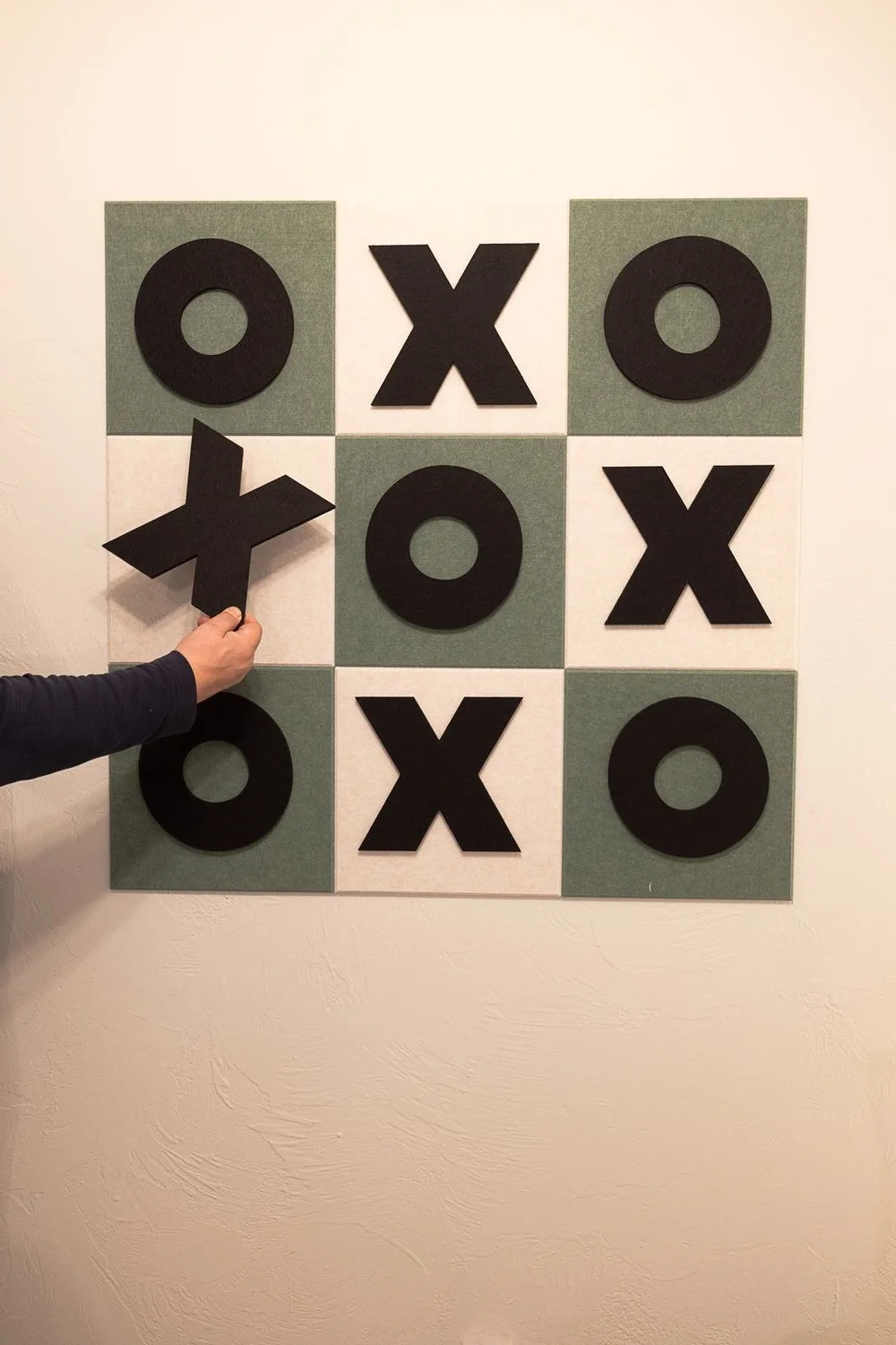 Tic tac toe on the wall in 105