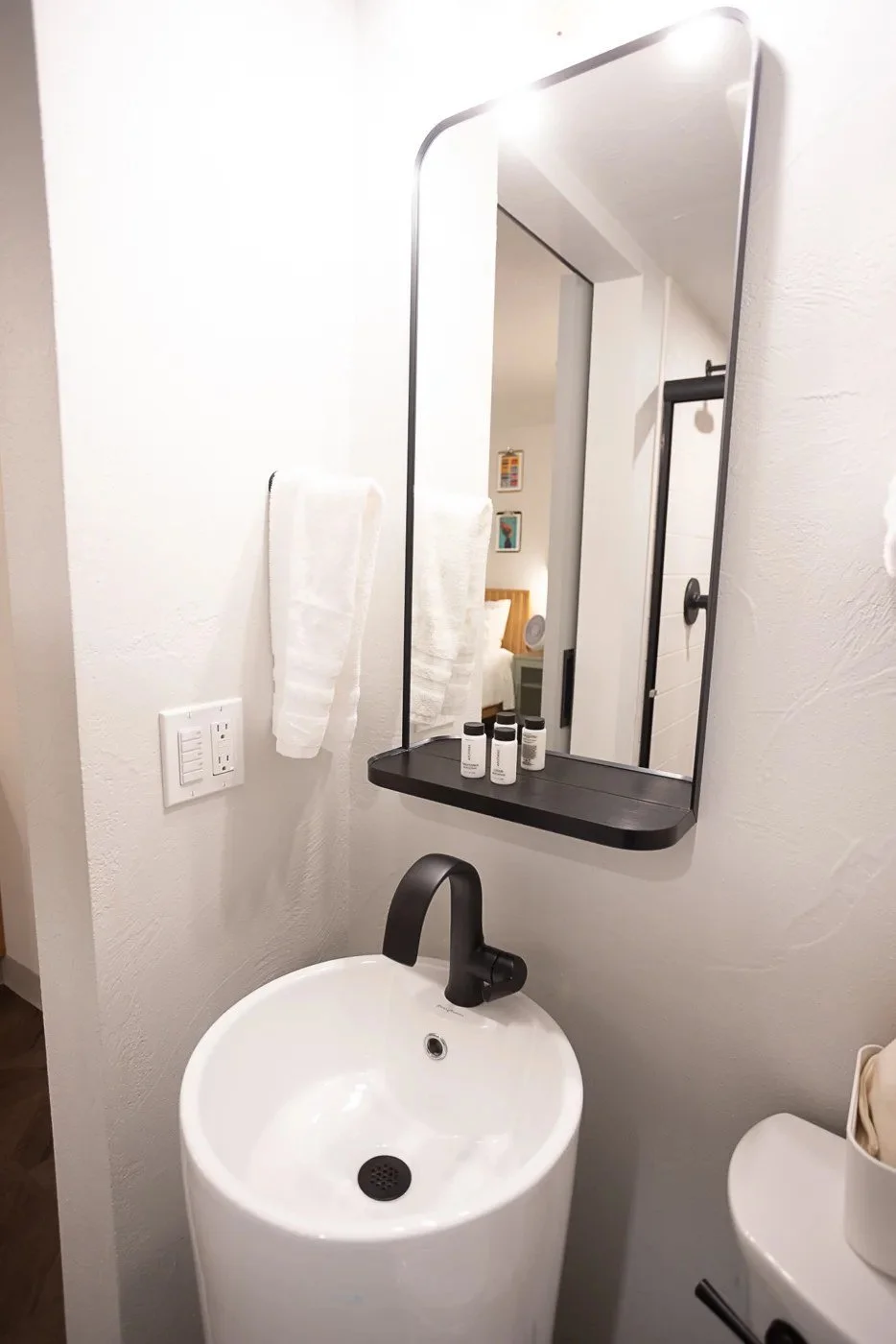 Pedestal sink + framed mirror