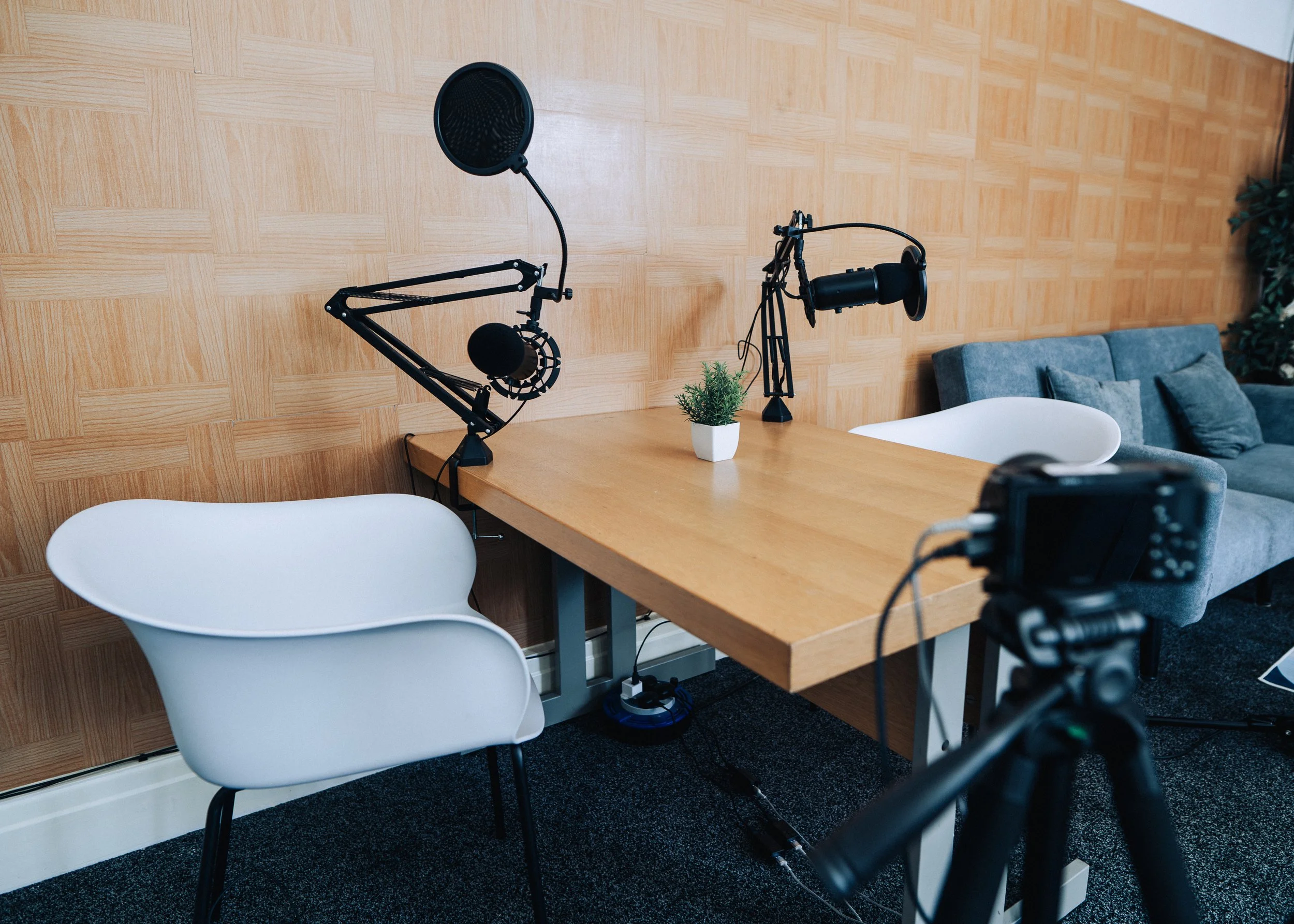 Podcast recording setup — microphones, booth