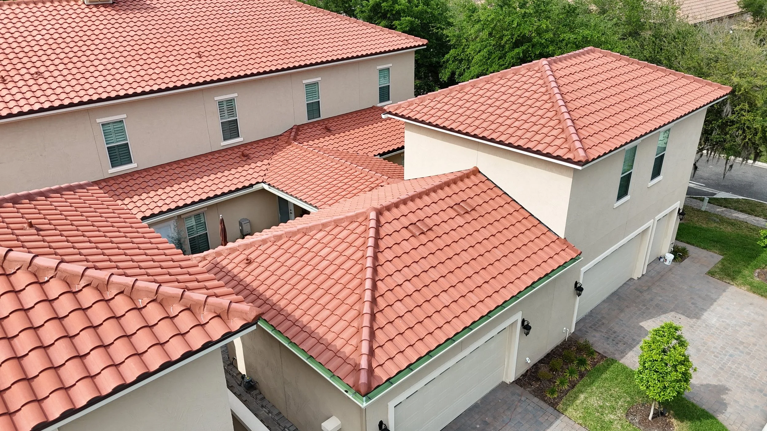 Aerial of tile-roof homes in Queens Harbour with new 6-inch seamless gutters installed