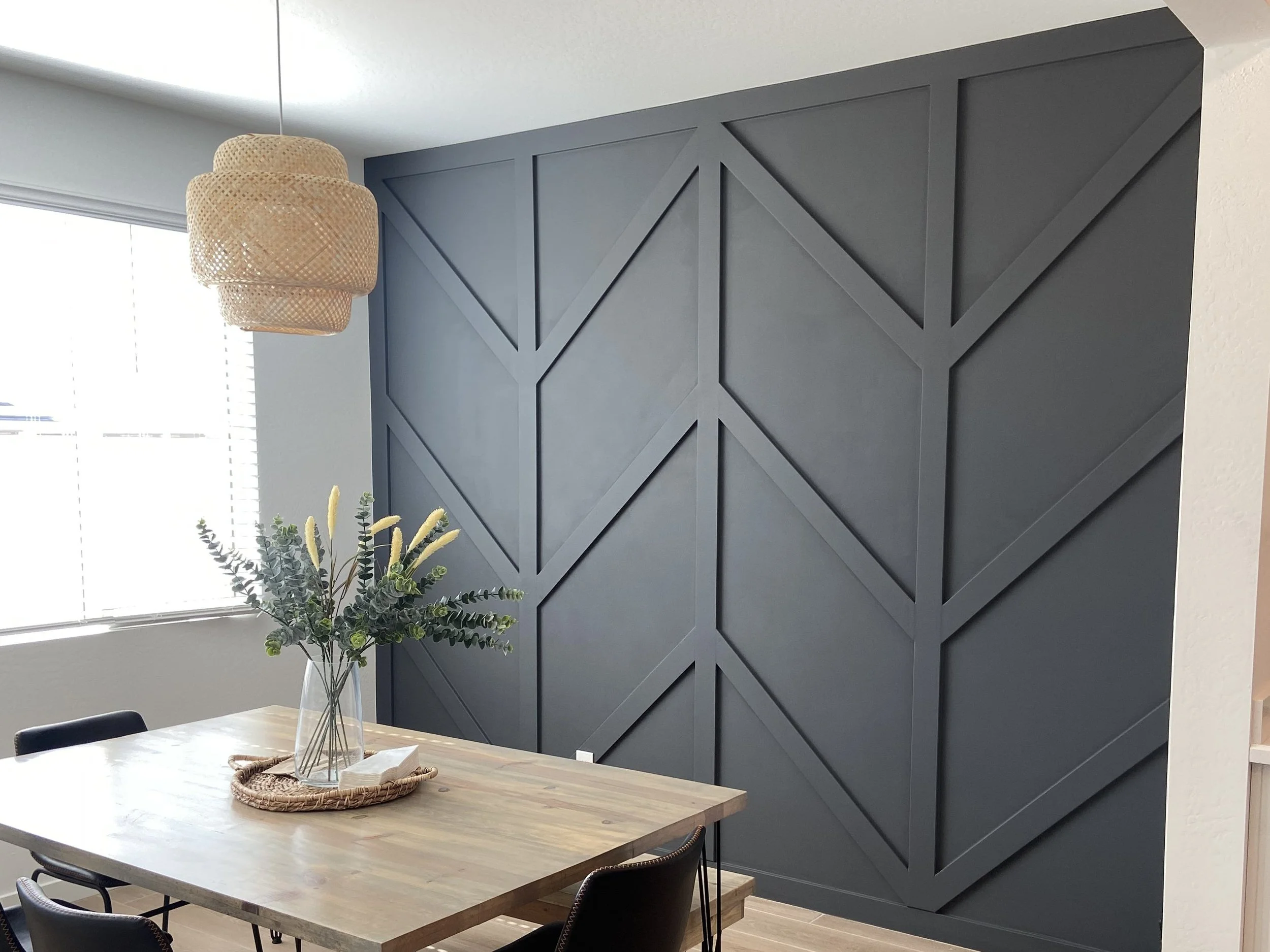 Completed KBK dark geometric feature wall in a dining room