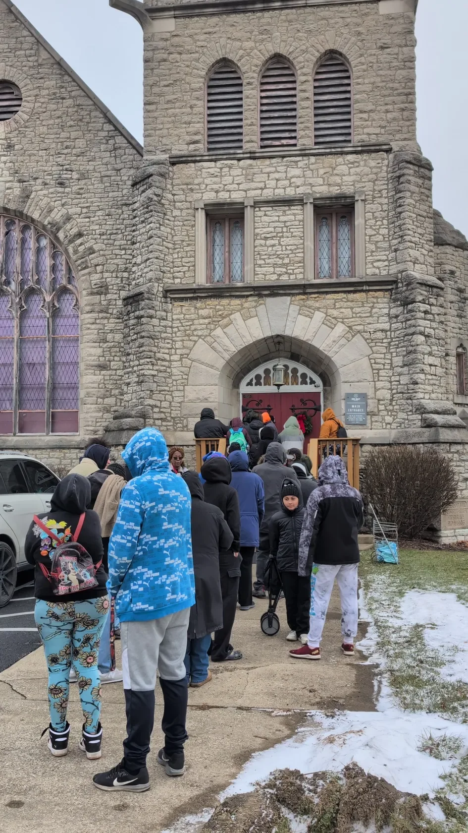 Neighbors entering the outreach building