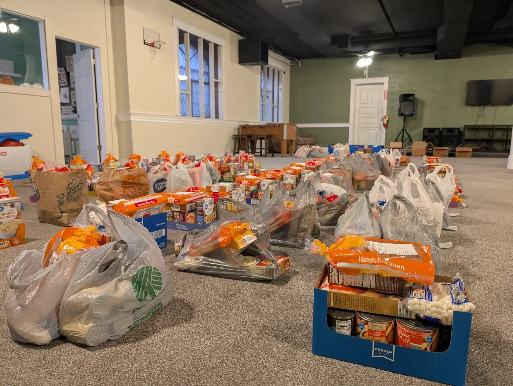 A room filled with Thanksgiving food donations