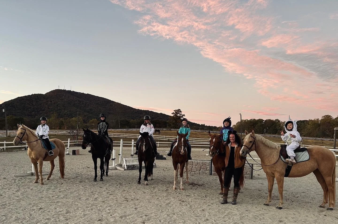 Blackrock lesson group with horses at sunset