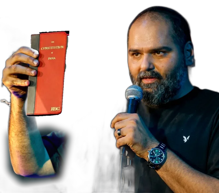 Kunal Kamra holding the Constitution of India
