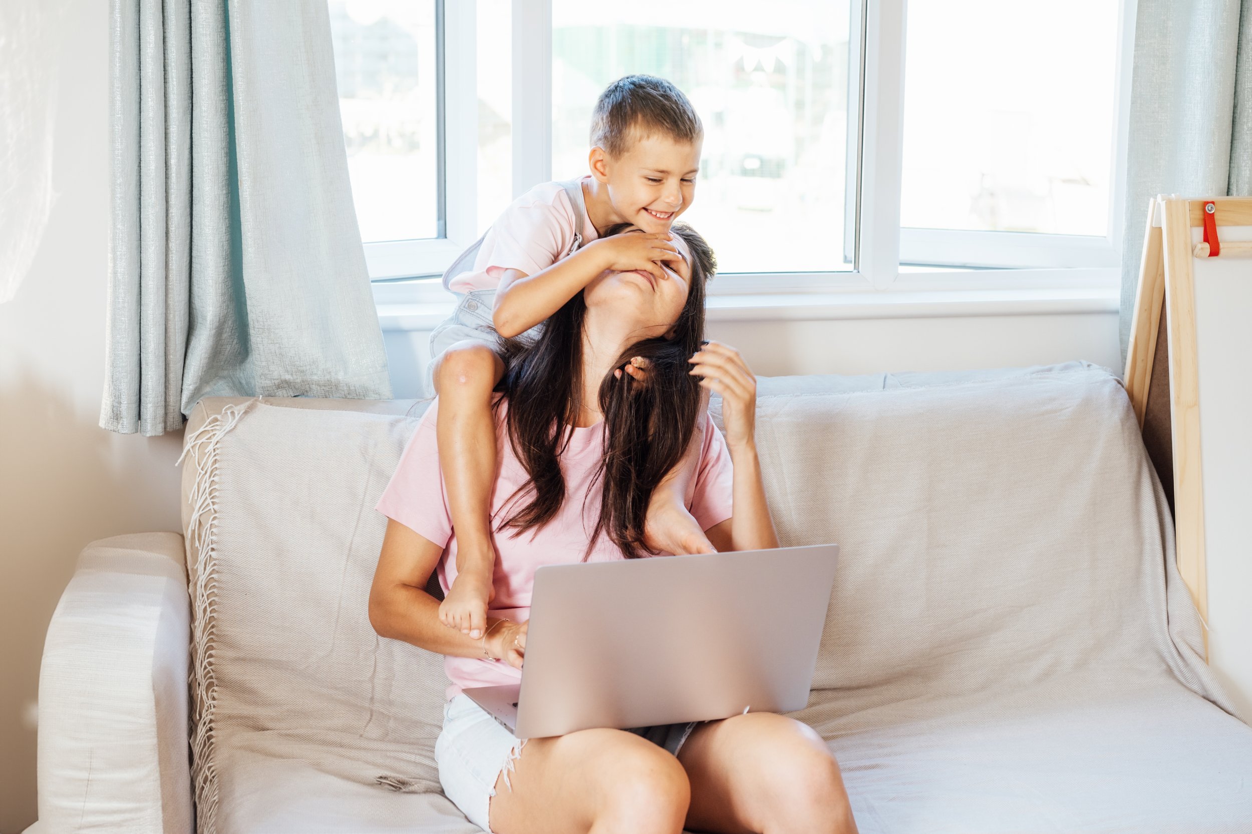 Mom working and homeschooling
