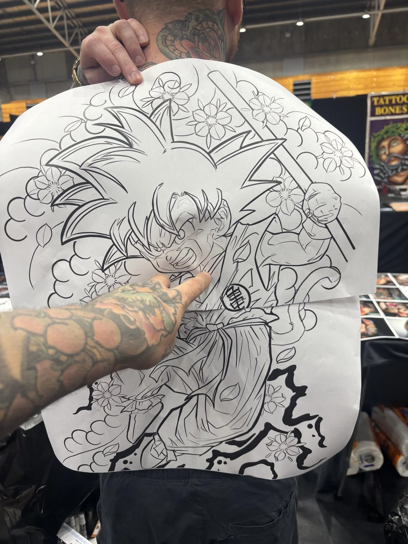 Printed Kid Goku design held against Levi’s back to check the size