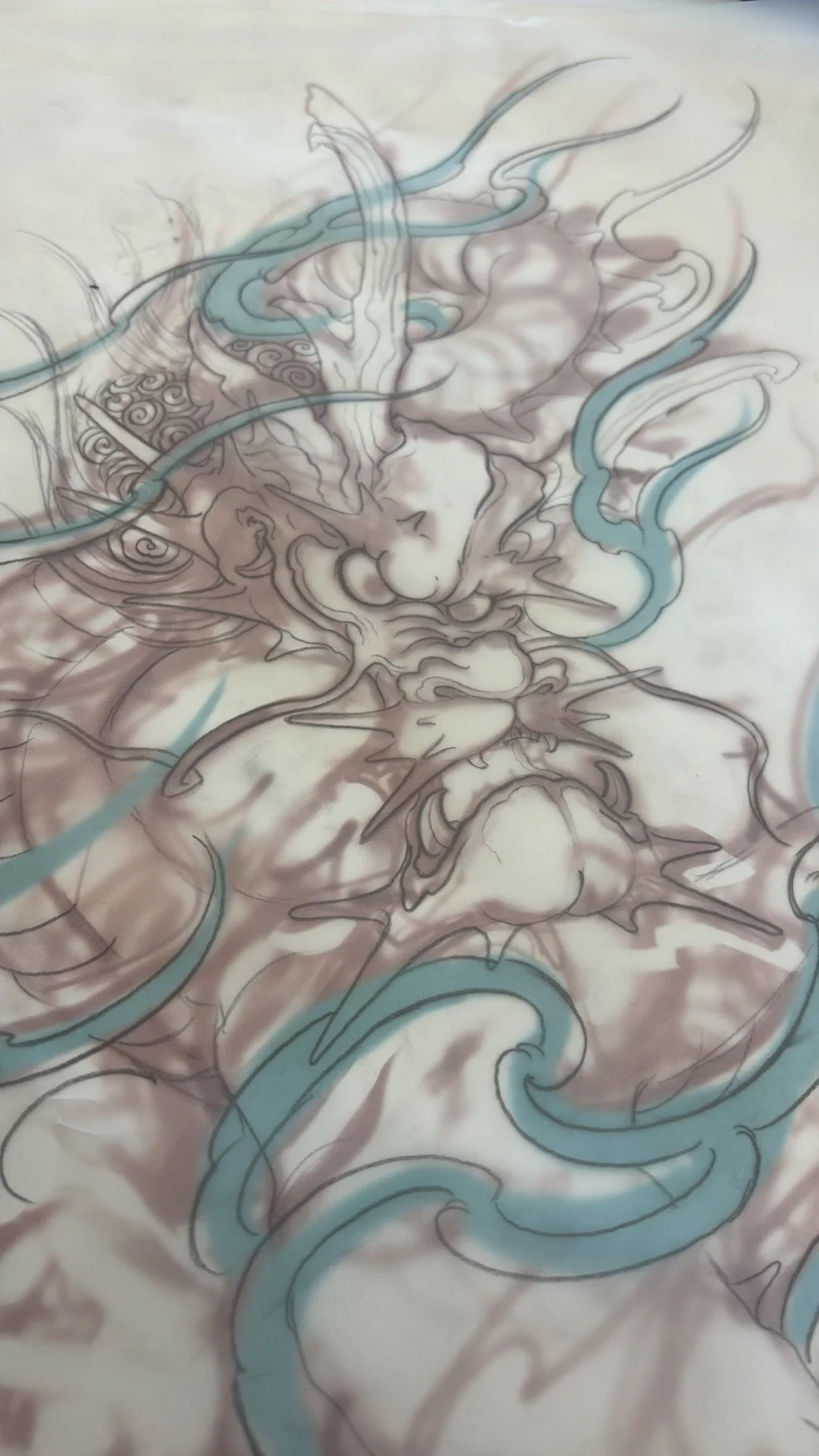 Early dragon sketch showing the head and flowing shapes