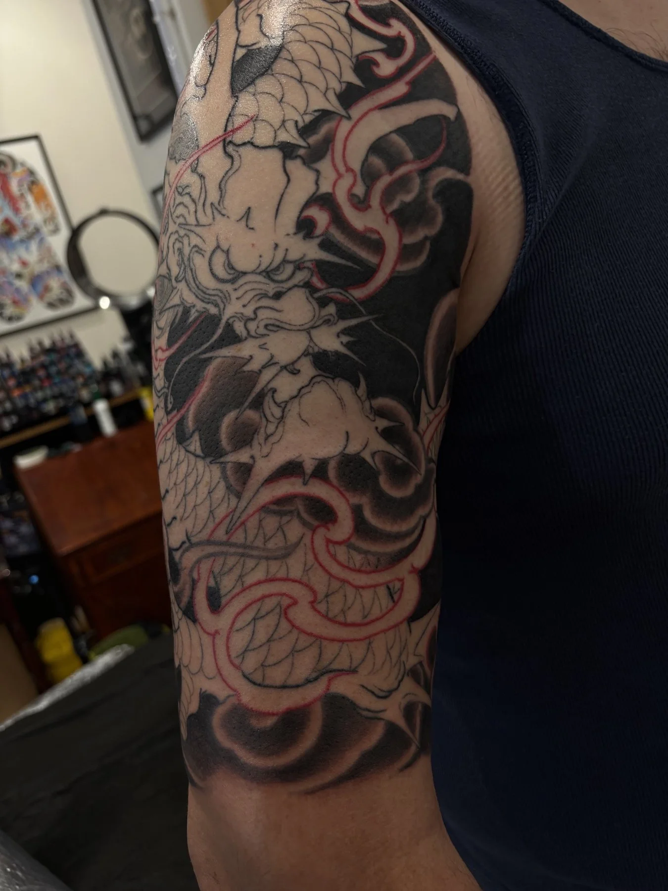 Joel’s dragon half sleeve after background shading, before colour