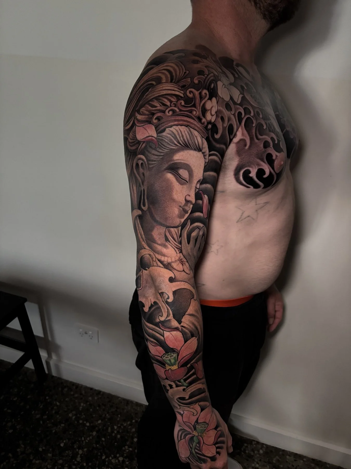 Completed Buddha and lotus sleeve showing the full outer arm