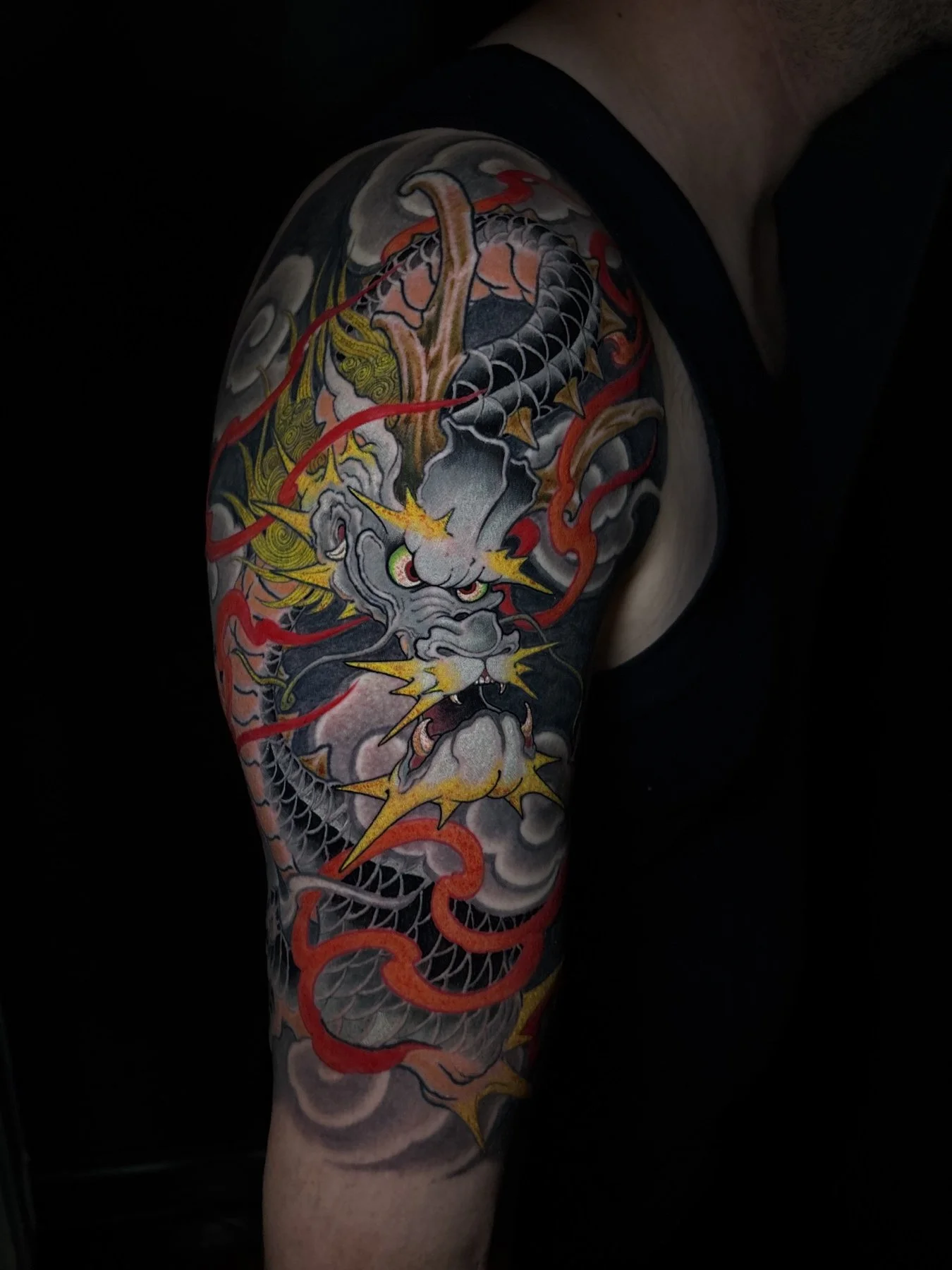 Joel’s completed dragon half sleeve with red flames and yellow details