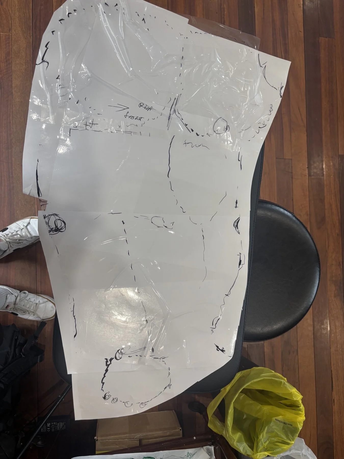 Tracing of Wade’s arm on adhesive book-covering plastic for planning his sleeve