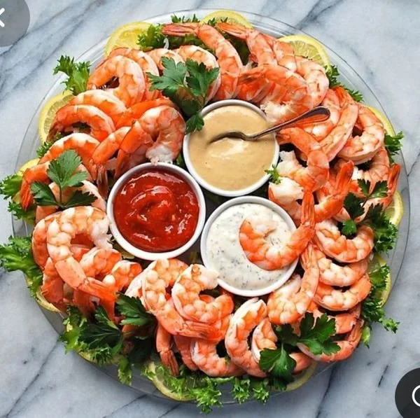 Socialized shrimp platter with dipping sauces