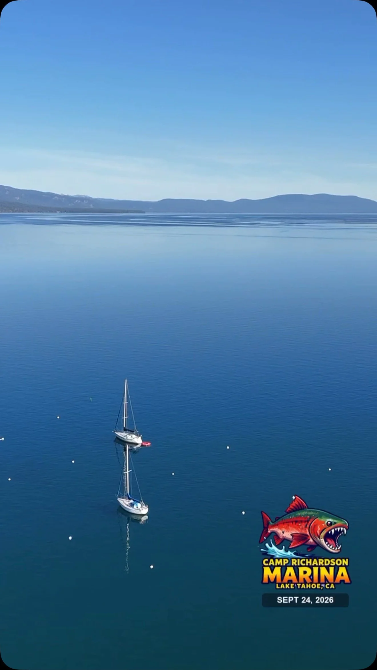 Two sailboats on blue Lake Tahoe with the Camp Richardson Marina logo.