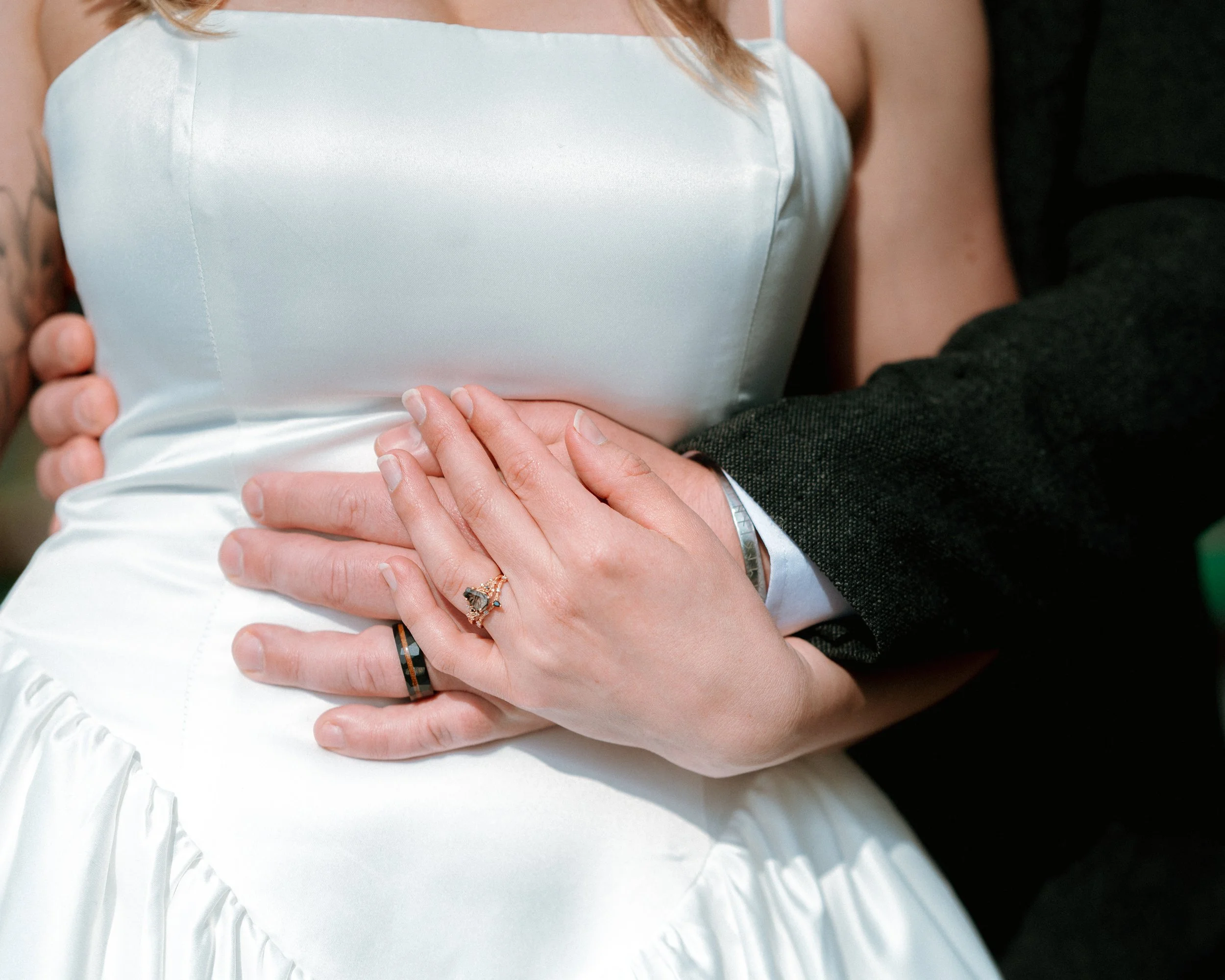 Close-up of a newly married couple's hands showing their wedding bands after an Irish ceremony
