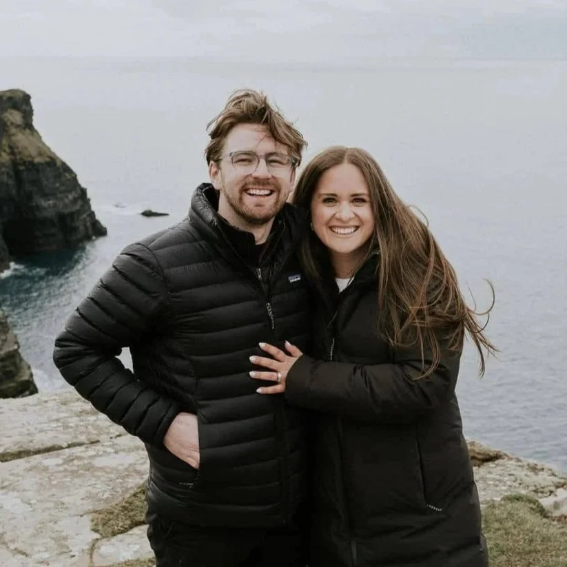 Yasmeen and Laurence, founders of Ladybird Ever After, on the Irish coast