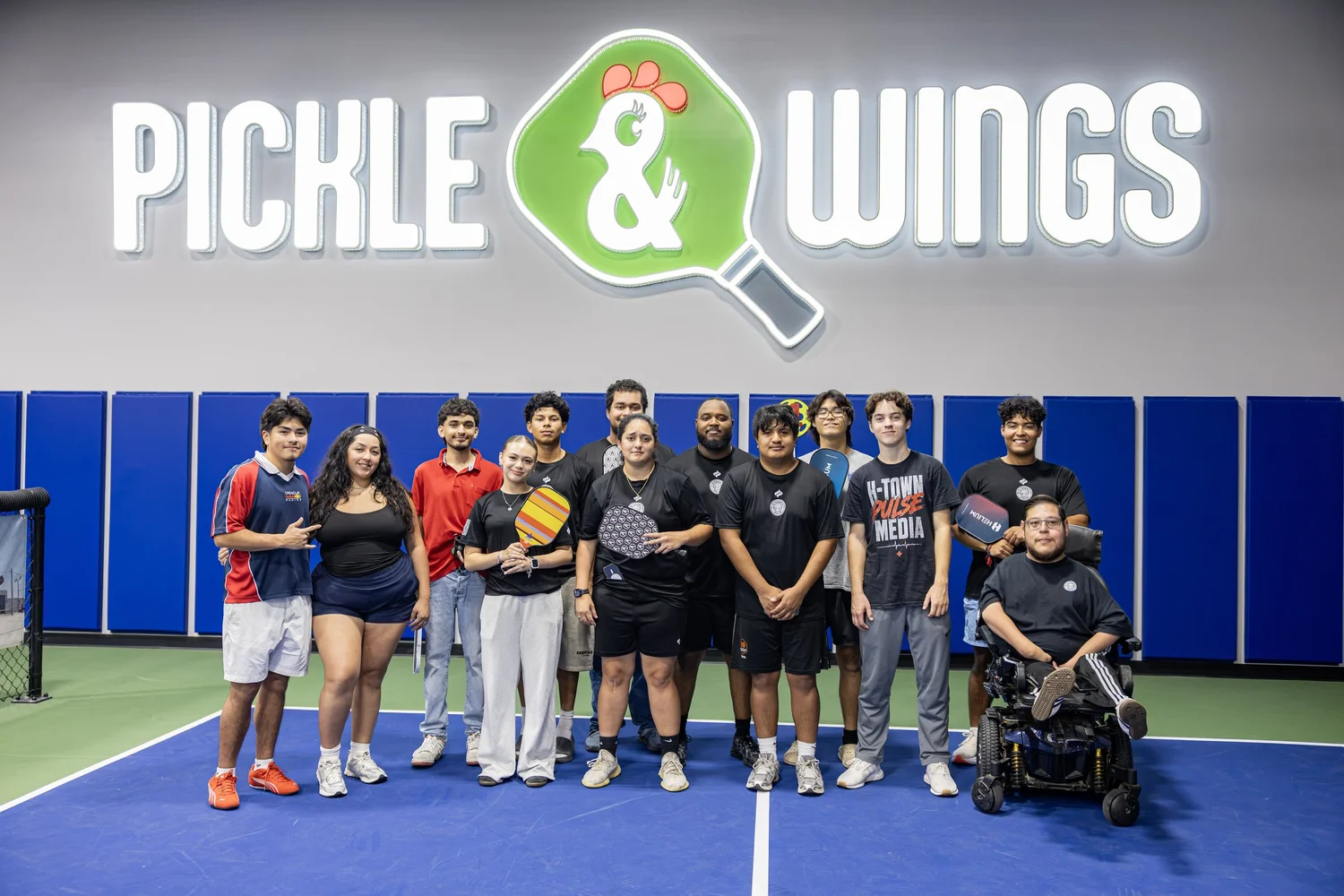 H-Town Pulse team together on an indoor pickleball court