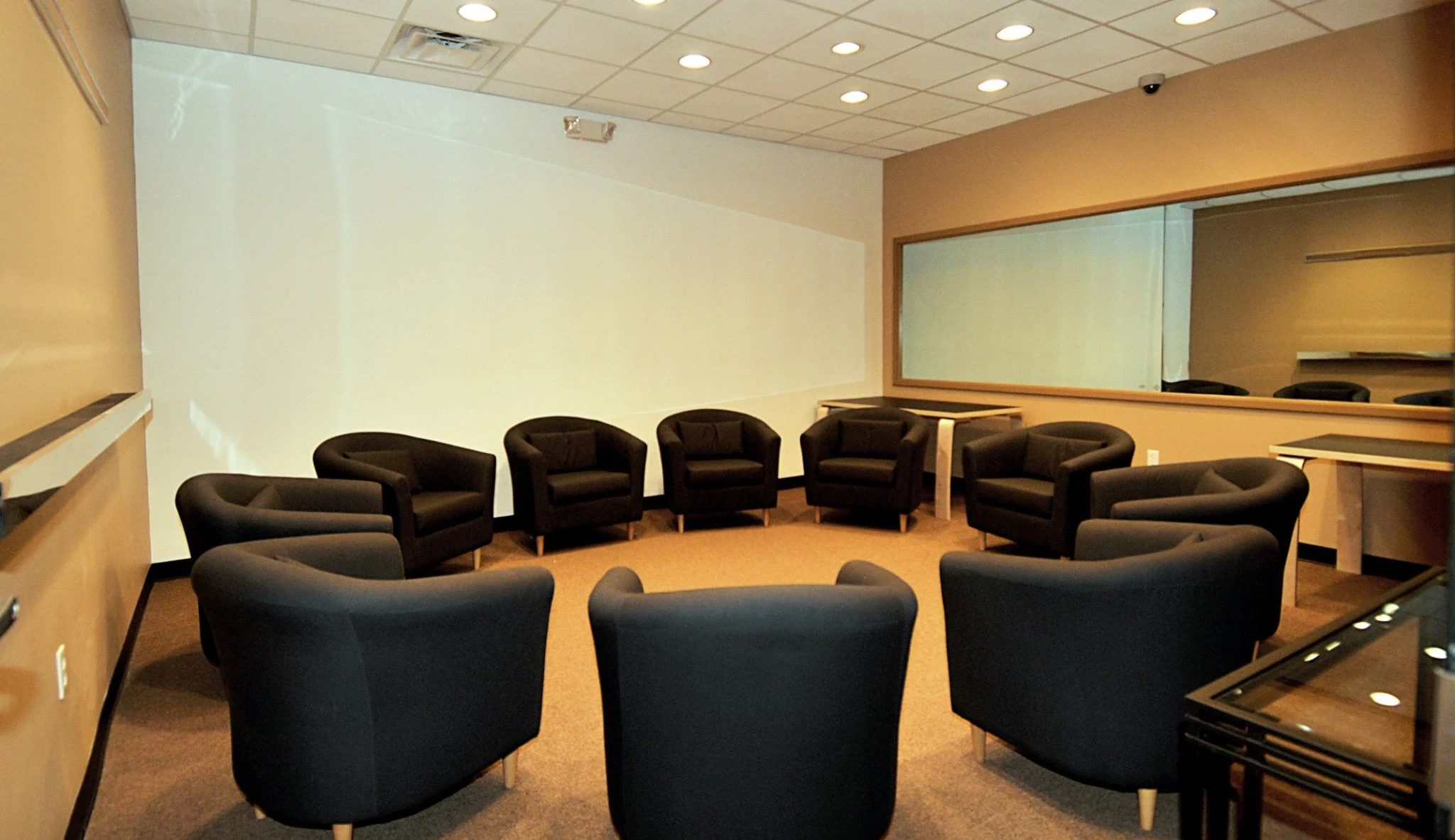 BCH focus group room in Louisville with comfortable seating and a two-way mirror