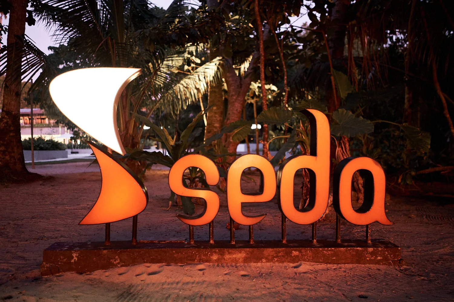 Seda Lio resort brand sign at dusk