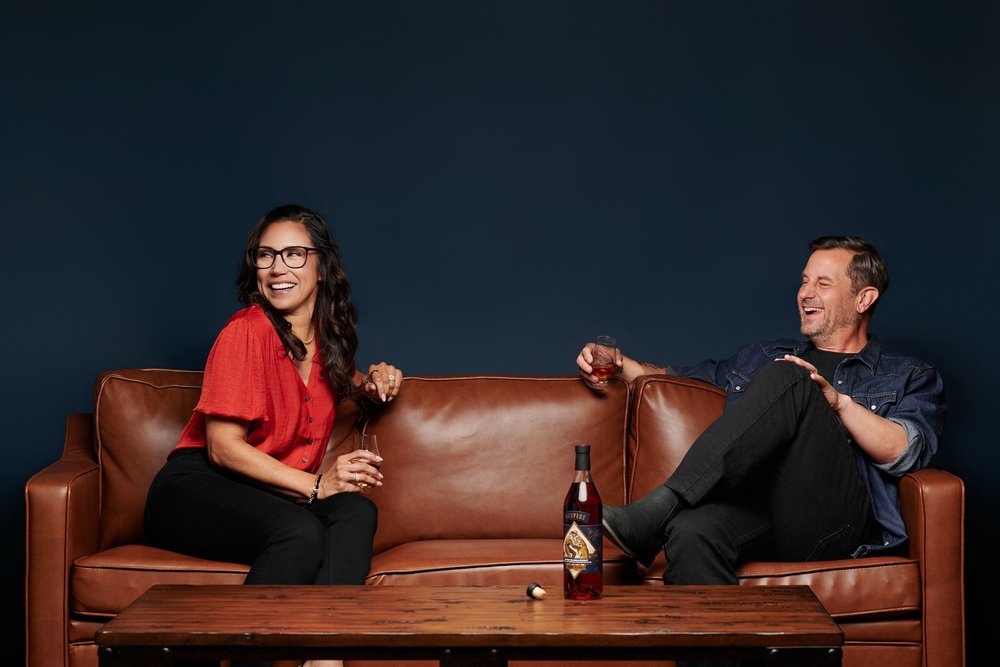 The two owners of Koopers Whiskey on a leather sofa, photographed by Ryan Dunbar for the brand campaign