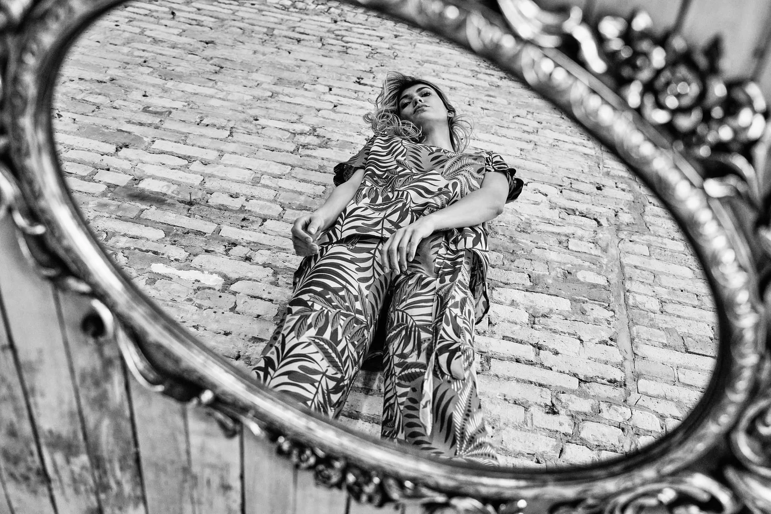 Lennard Taylor campaign model reflected in gilt mirror