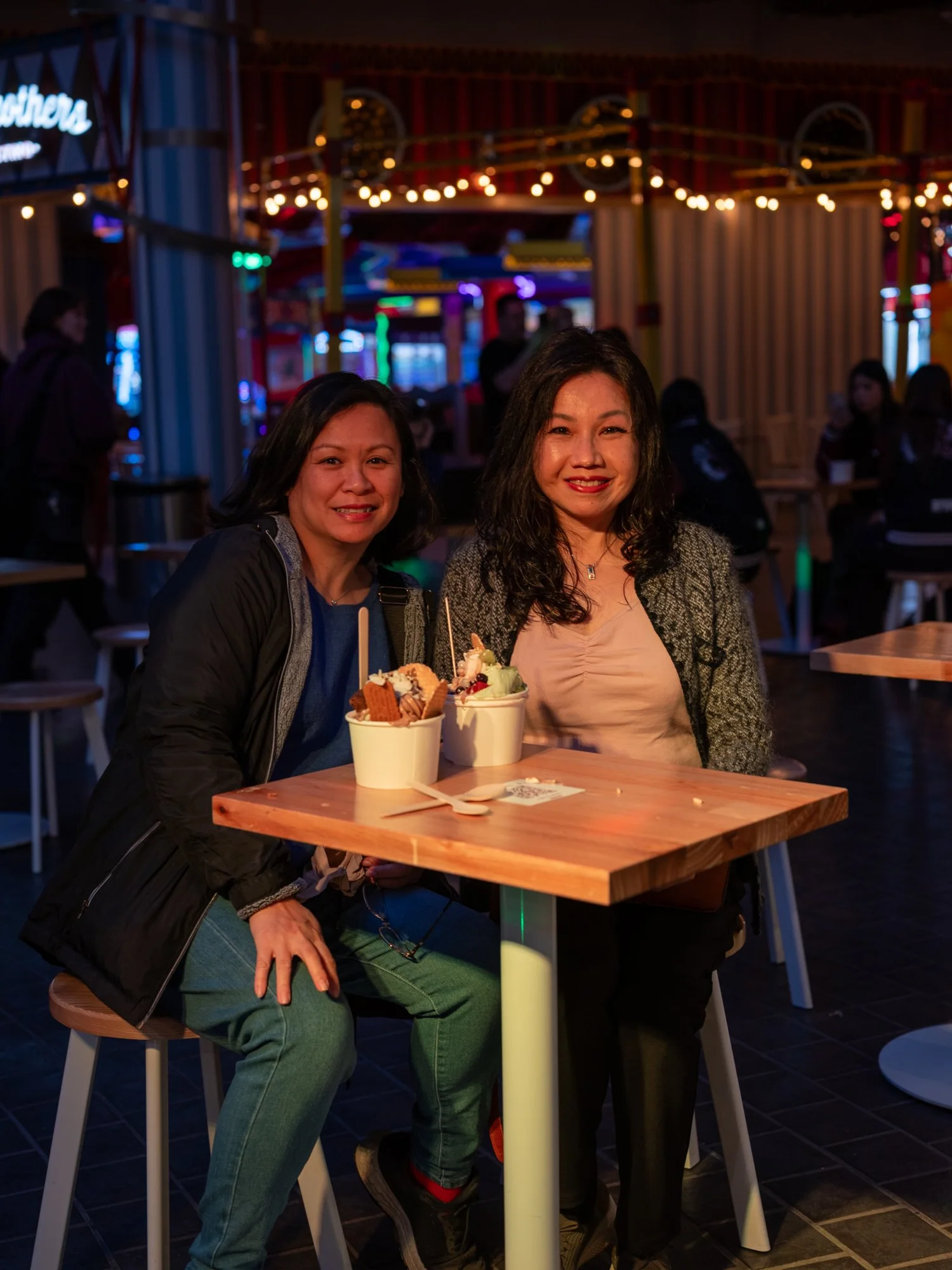 Two customers enjoying frozen yoghurt at the Yovie opening